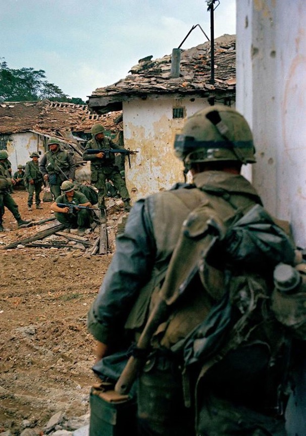 U.S. Marines in a housing area near the Citadel in Hue, Vietnam, during the Tet Offensive, Feb. 18, 1968 pinterest.