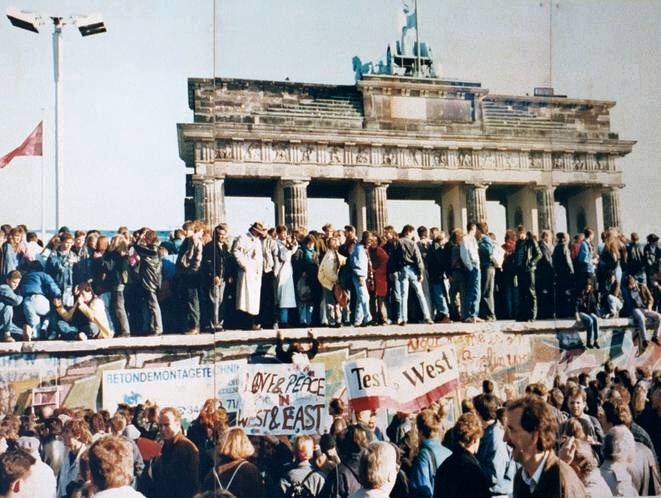 Berliners atop the wall in November of 1989.