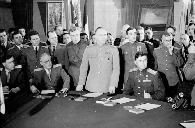 The signing the German Instrument of Surrender in 1945, Marshal Georgy Zhukov is standing in the middle