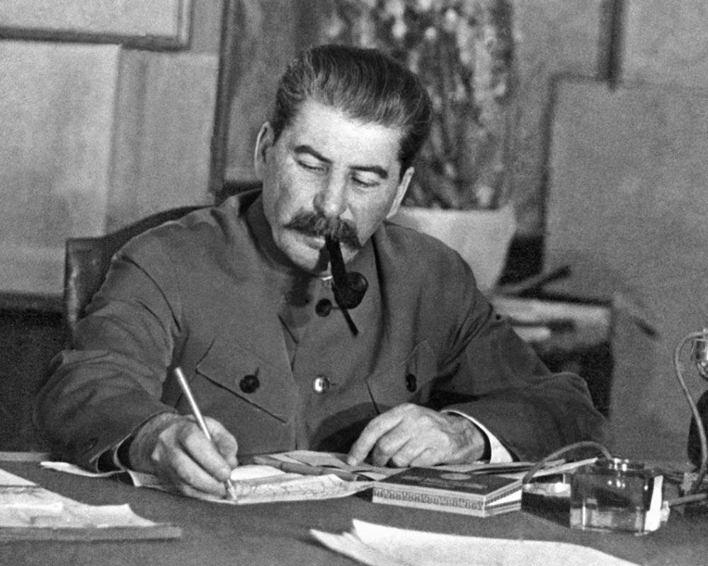 A photograph of Joseph Stalin at his desk, working. source