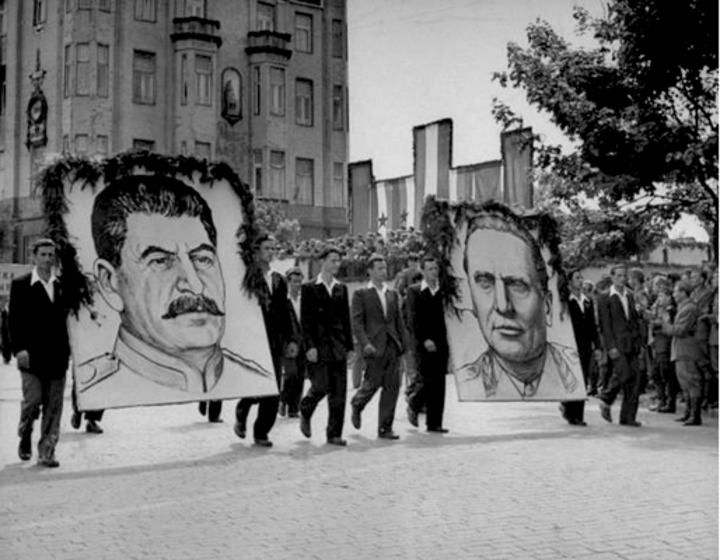 Portraits of Stalin (left) and Tito (right) paraded on the streets of Belgrade. masina.rs